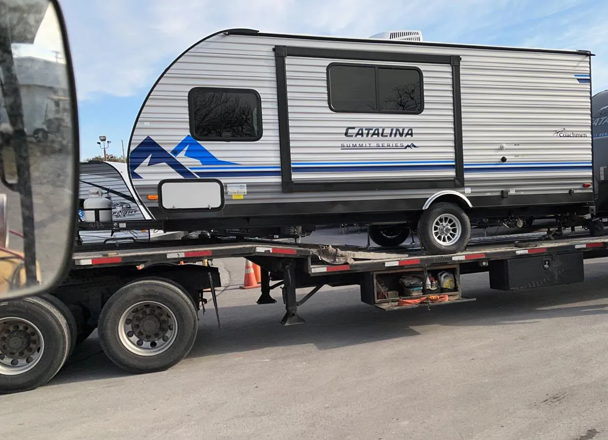 Two travel trailers standing on their own, with no cab and no engine