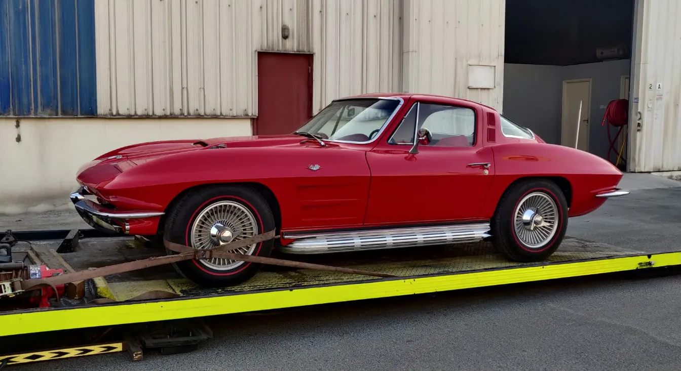 An American sports car loaded flat for transport