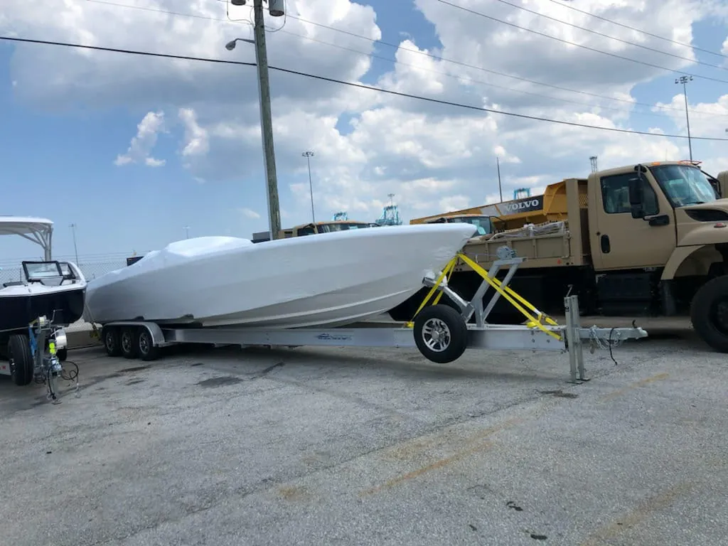 A boat wrapped and secured on its trailer